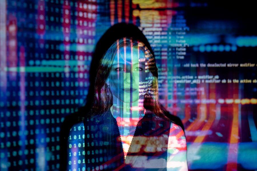 Woman looking at AI coding