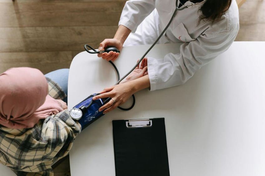 Doctor taking a patient's blood pressure