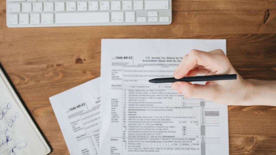 Tax forms on wooden desk
