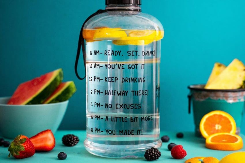 A full water bottle with sliced fruit